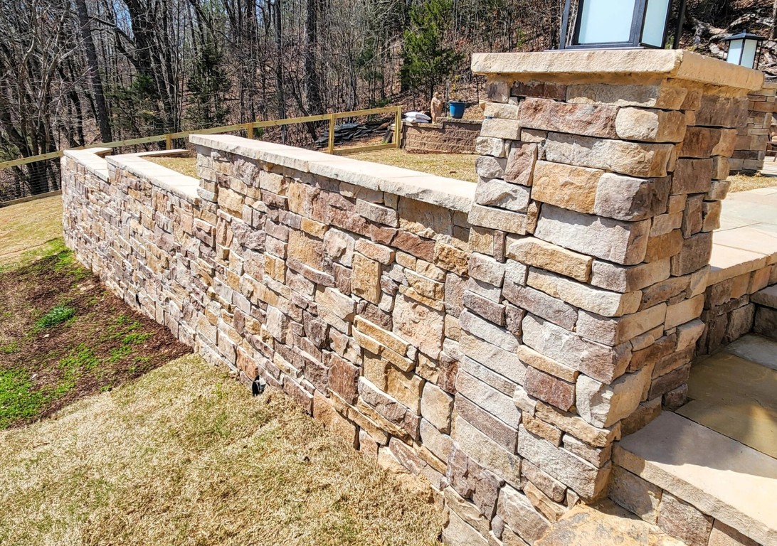 Professional masonry work showcasing natural stone retaining wall in Elk Grove, CA